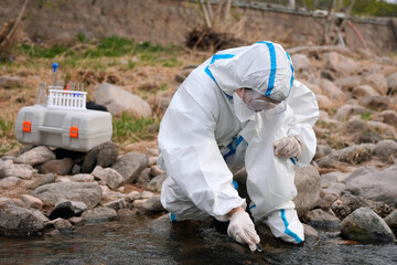 Environmental Research: A Scientist Collecting Water Samples for Analysis