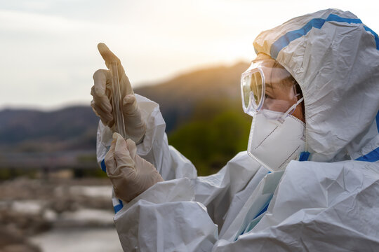 Dedicated Healthcare Worker Conducting Field Research with Precautions in Nature