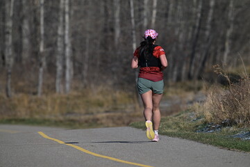 Fototapeta premium young woman running in the park
