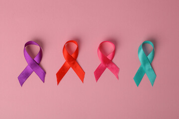 Colorful Awareness Ribbon Arranged On Pink Background. World Cancer Day. Cancer Awareness Month.