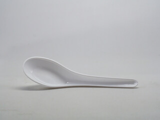 White plastic soup spoon isolated on white background