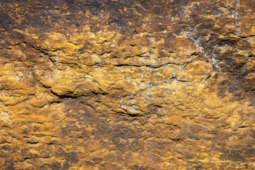 Macro abstract texture background of the grinding surface on a 19th century grist mill stone