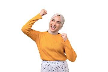 Beautiful excited Asian girl wearing hijab raising fist, celebrating success isolated on transparent background