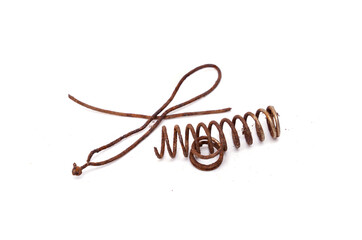 Scrap metal, coil spring full of dust and rust isolated on white background.