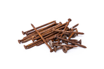 A pile of old nails and screws full of rust that has never been used isolated on white background.