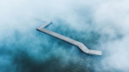 Floating bridge on a misty lake disappearing into a dense fog enchanting and surreal atmosphere