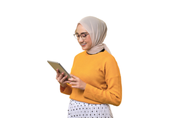 Smiling beautiful Asian girl wearing hijab using digital tablet isolated on transparent background