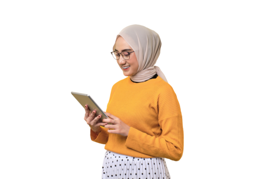Smiling beautiful Asian girl wearing hijab using digital tablet isolated on transparent background