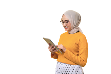 Smiling beautiful Asian girl wearing hijab using digital tablet isolated on transparent background