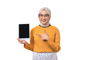 Smiling beautiful Asian girl wearing hijab pointing at digital tablet with black screen isolated on transparent background, mockup