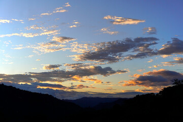 Sunset background. Dramatic majestic sunset landscape. Sky with clouds in the background of the light of the dawn sky. Sunset with clouds in various shapes. costa rica