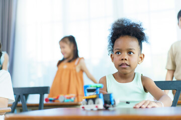 Group of diverse children enjoy learning about the STEM.