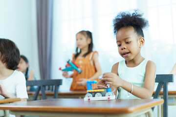 Group of diverse children enjoy learning about the STEM.