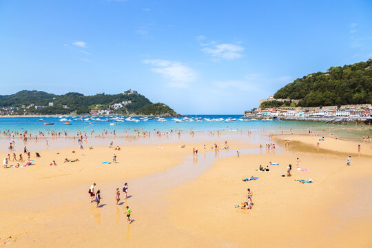 Playa de la Concha beach crowded with tourists, San Sebastian, Spain
