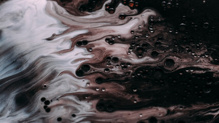 Oil art. Paint mix. Defocused white milky foam color ink water bubbles fluid drops spilling on...