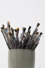 Brushes and spatulas on a white background. The tools of an artist or a sculptor for drawing. Creative professions, master classes. High quality photo