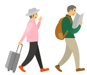 キャリーケースを持った高齢夫婦がガイドを見ながら旅行中に散策