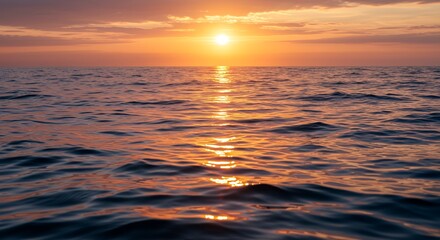Obraz premium Ocean Sunset with Golden Light Reflecting on Water Surface