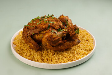 Murgh Musallam or Masala Roasted Chicken Served With Rice is Mughlai Dish from India and Pakistan.