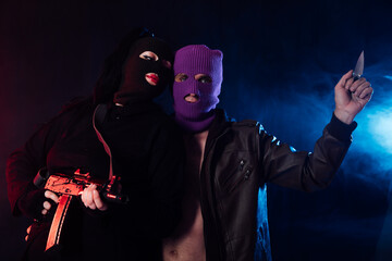 Man And Woman Wearing Mask With Gun