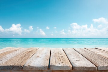 Fototapeta premium Wooden planks on a beach with ocean waves and a clear blue sky in the background, Hello Summer background.