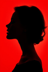 silhouette profile of a woman, red background
