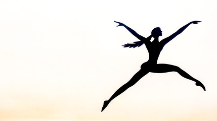 Fototapeta premium Silhouette of a dancer leaping with grace and extended arms