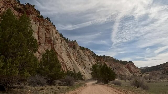 Driving desert trail red rock river valley Utah POV. Southern Utah off road recreation nature and exploring. Desert mountain canyon river valley trail ride adventure area. Remote wilderness.