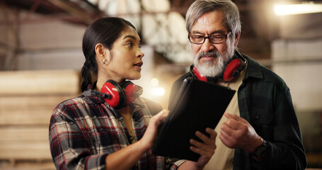 Online, team and people with tablet, carpenter and intern with research for woodworking technique. Workshop, mature mentor and review of info on tech, woman and collaboration for furniture business