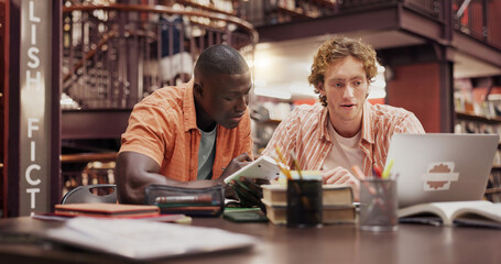 Students, men and together with laptop at library for group project, research and education at university. People, computer and review with books, calculator and learning for scholarship at college