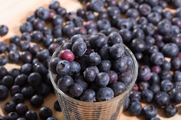 Close up of fresh blueberries on wooden background