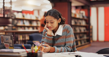 Woman, student and phone at library, texting and happy with results, notification or chat at college. Girl, smartphone and click on mobile app for education, research or study break with social media