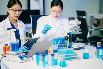 Fototapeta premium Biologist taking experiment with plants working in biochemistry laboratory.