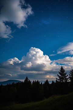 there is a cloud that is in the sky over a field