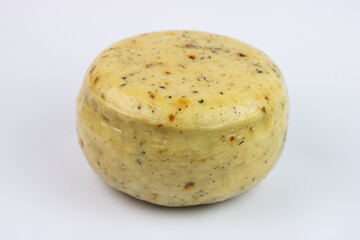Hard cheese round isolated on white background - Herb cheese