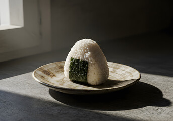 Artisanal Onigiri with Seaweed and Sesame Seeds, Displayed on a Rustic Wooden Surface