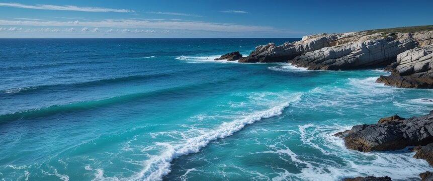 A beautiful blue ocean with a rocky shoreline