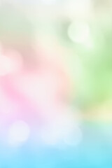 Colorful abstract vertical background bokeh lights. Sunlight defocused bokeh on blurry multicolored spring summer natural background.