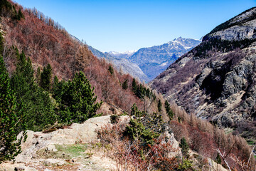 Beautiful young girl hiking in the magnificent landscapes of the Cirque de Gavarnie in the Pyrenees, a UNESCO World Heritage Site.