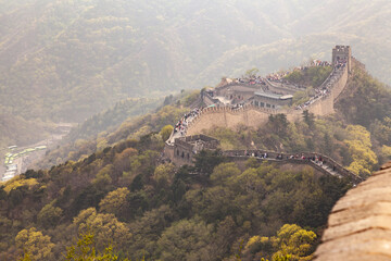 Fototapeta premium The Great Wall of China winding through the mountains