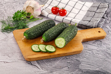 Raw green cucumbers with slices