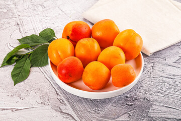 Raw ripe sweet apricots heap