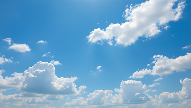 A bright, invigorating sky of sky blue, with scattered fractus clouds, appearing as torn or ragged fragments drifting across the expanse