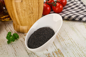 Black dry Nigella seeds in the bowl