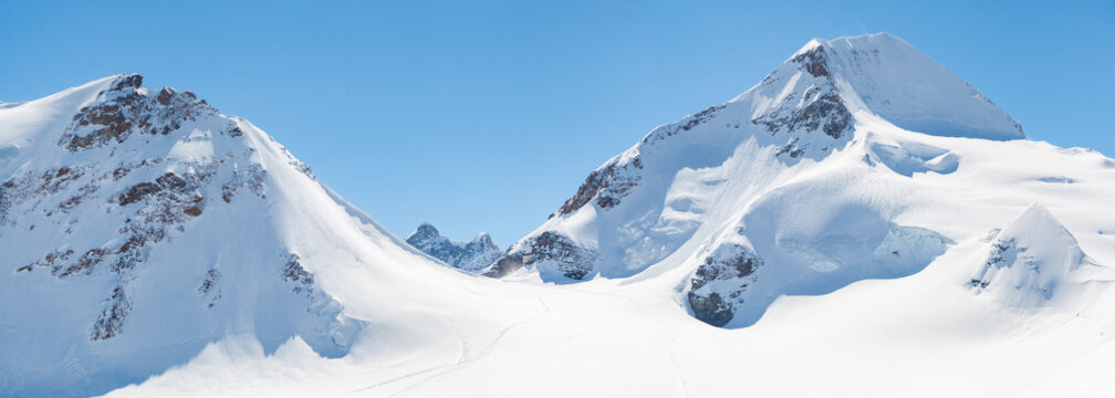 M&ouml;nchsjoch Hut between snow-covered mountains