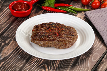 Grilled beef burger cutlet with sauce
