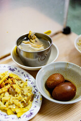 Taiwanese braised egg and bamboo shoot sides with clear soup, highlighting traditional local flavors and home-style presentation