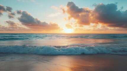 Sun setting over the ocean with beautiful clouds in the sky.