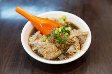 Taiwanese sesame wontons in a creamy sesame sauce, tender dumplings with rich, nutty flavor, served in a traditional bowl