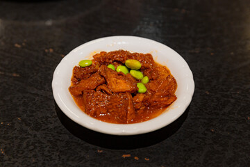 Shanghai-style sweet wheat gluten dish served in rich syrup-like soy sauce glaze, sticky and glossy...